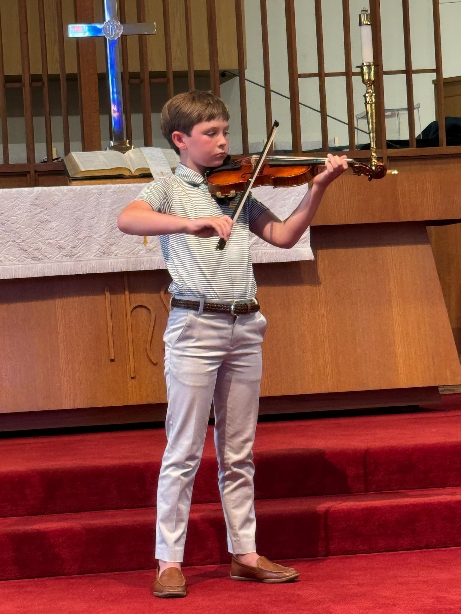 Young violinist performing at a KSA recital