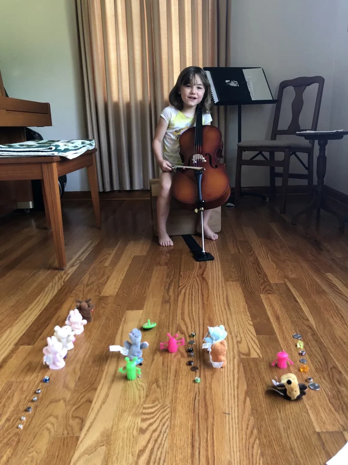 A child using playful finger puppets during music practice